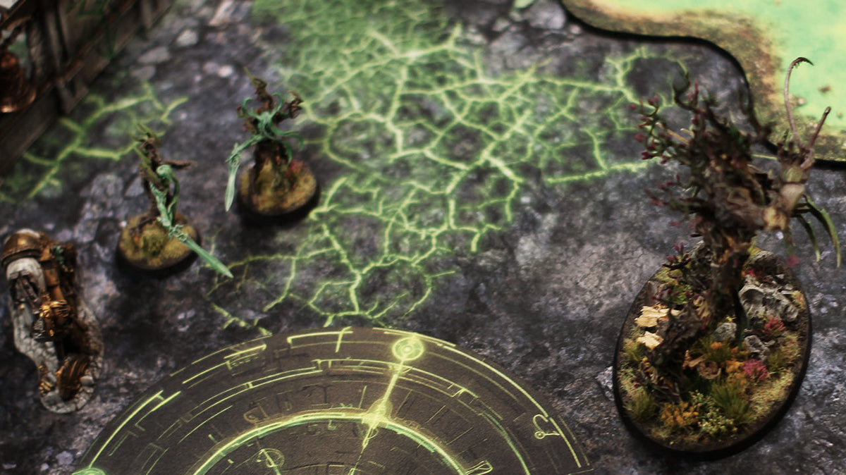 Green Blight Battlefield gaming mat with circular objective markers, miniatures and terrain for Age of Sigmar.